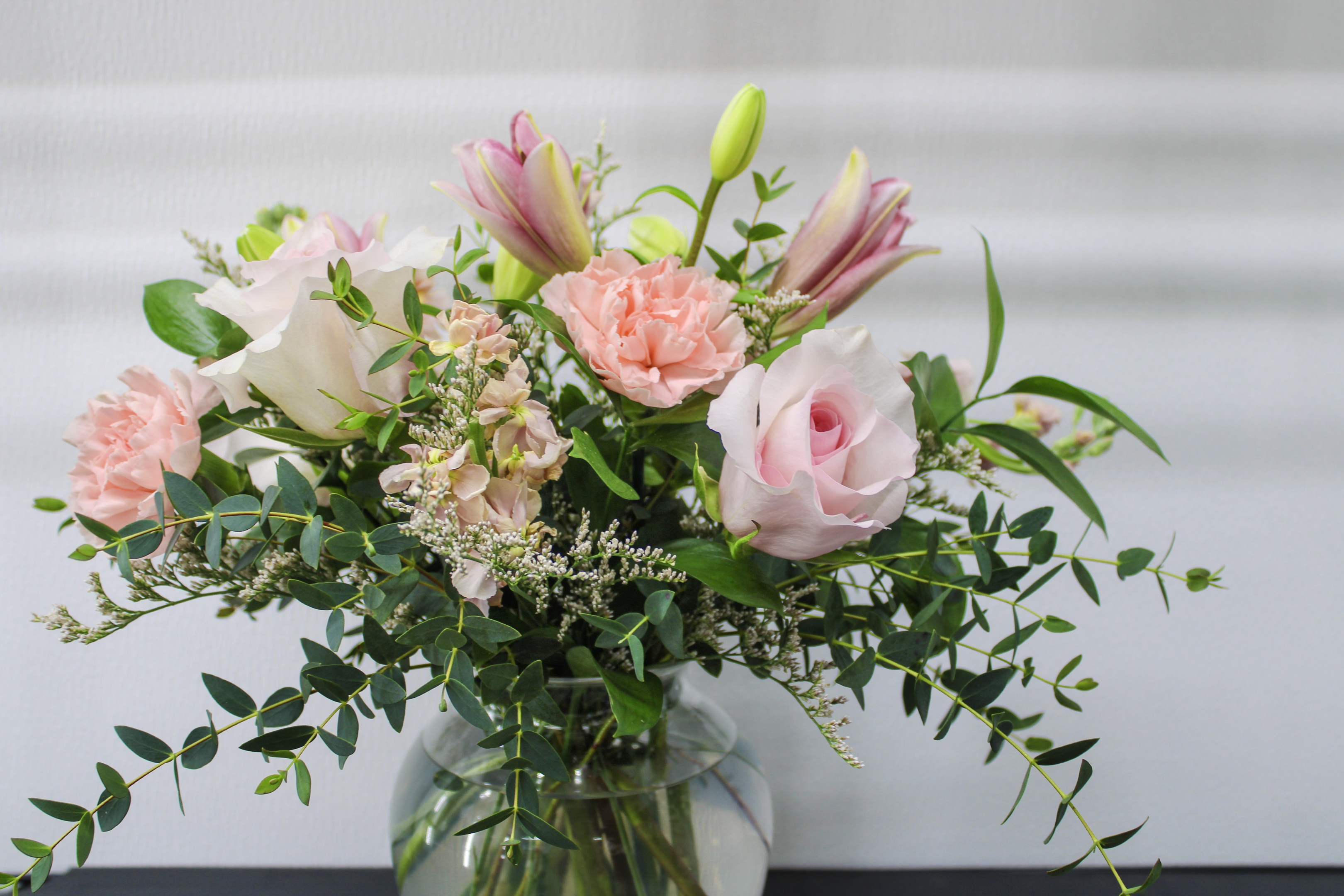 dozen red rose arrangements